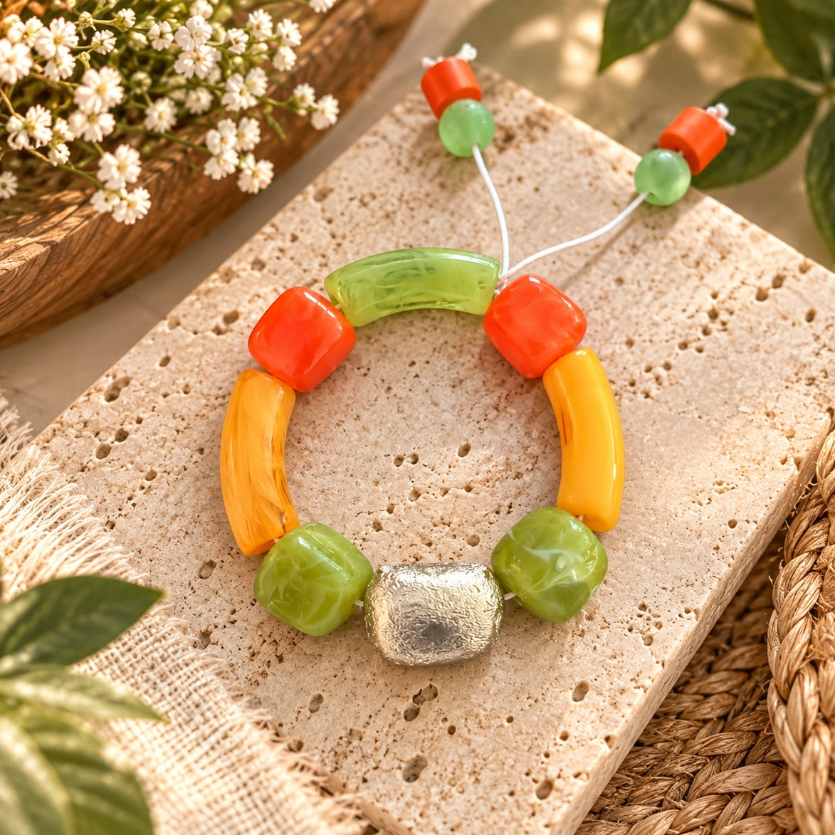Colorful adjustable bracelet with orange, green, yellow and silver beads