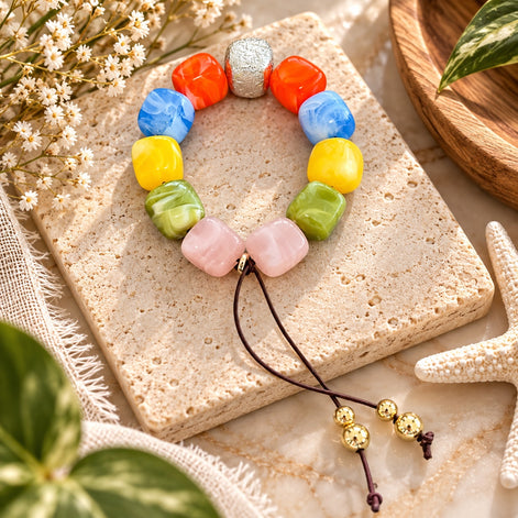Colorful adjustable bracelet with coral, blue, yellow, green and blush beads